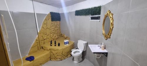a bathroom with a sink and a toilet and a shower at Depa más pileta en Ypane in Ypane
