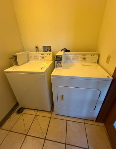 two machines sitting next to each other in a kitchen at Dodgeville inn & suites in Dodgeville