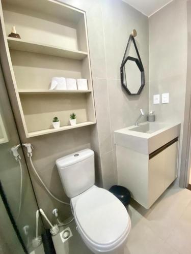 a bathroom with a toilet and a sink at Flat FM20 Apt 401 in João Pessoa