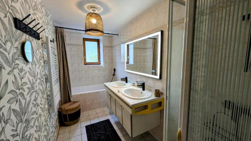 a bathroom with a sink and a shower at La grande ourse in Panazol
