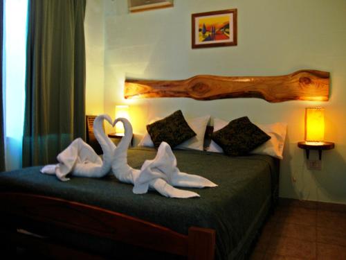 Ένα ή περισσότερα κρεβάτια σε δωμάτιο στο Cabañas Rancho Unelen