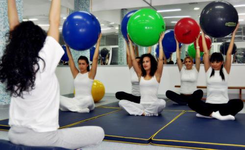 a group of women sitting on the floor holding balloons at Medical and Spa Centre Merkur in Vrnjačka Banja