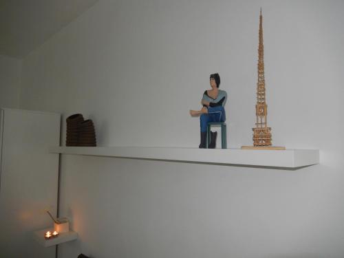 a figurine of a woman sitting on a shelf at Sant' Alfonso Maria de Liguori in Nola