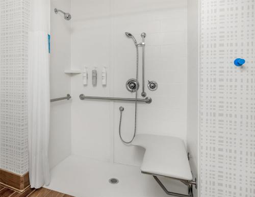 a shower stall in a bathroom with white walls at Hampton Inn & Suites Grants Pass in Grants Pass