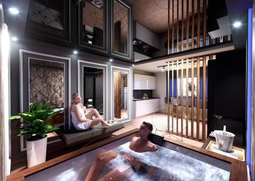 a man and woman sitting in a bath tub in a room at Regim Hotel Hanea jacuzzi in camera,piscina exterioara si sauna comuna in Sibiu