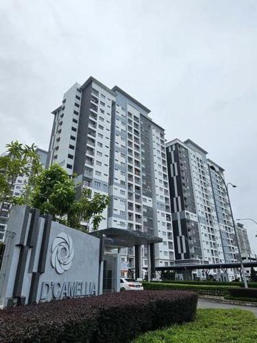 a large apartment building with a sign in front of it at D'Camellia 43500 Semenyih Homestay in Semenyih