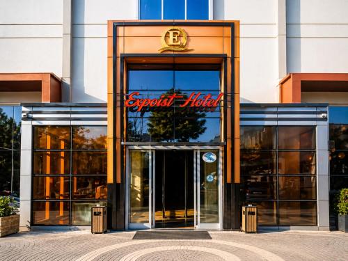 a front door of a store with a sign on it at Expoist Hotel in Beylikduzu