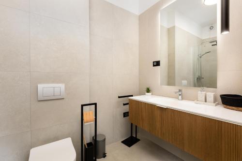 a bathroom with a sink and a toilet at Villa Vela in Brzac