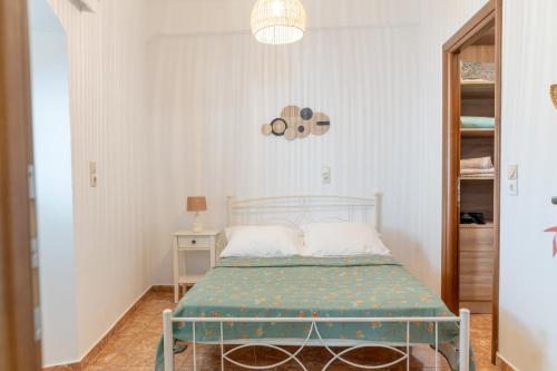 a small bedroom with a bed in a room at The Stone Nest in Kefalos