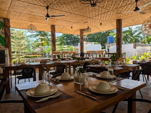 a dining room with wooden tables and chairs at Severina Lodge in San Juan