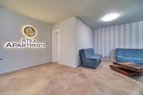 a waiting room with two chairs and a table at 100m from the BEACH! ALDEA complex with pool in Kavarna