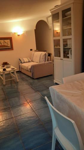 a living room with a bed and a table at la Baracca in Genoa