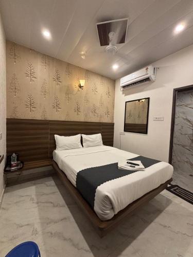 a bedroom with a large bed in a room at The Darsya in Varanasi