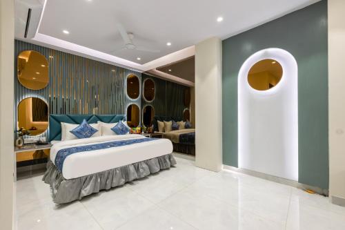 a bedroom with a large bed in a room at The Arjun - Newly Built Hotel Just 3 Mins from Metro and Railway Station in New Delhi