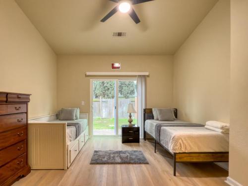 a bedroom with two beds and a window at Oakley Bay Area Haven in Oakley