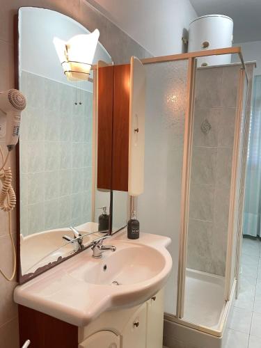 a bathroom with a sink and a shower at Casa Kate in Scanzano