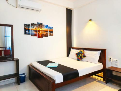 a bedroom with a bed in a room at Lake Edge Resort in Anuradhapura