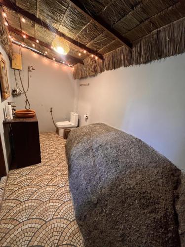 a room with a bed and a toilet in it at Sunset Sea View House Large Terrace 2BR in Ban Nok
