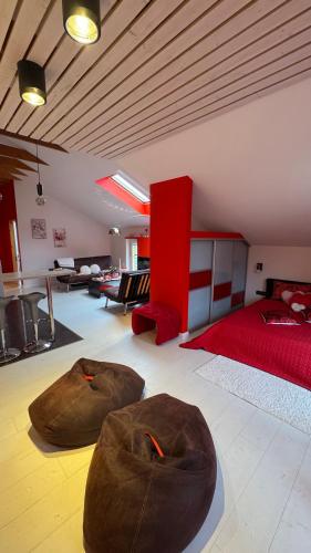a bedroom with two bean bags on the floor at Rožu romantika in Cēsis