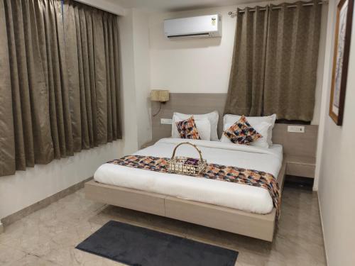 a bedroom with two beds in a room at Gianmala Residency South Ex New Delhi in New Delhi