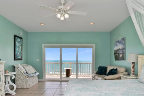 a bedroom with a bed and a view of the ocean at Villa del Sol by Pristine Property Vacation Rentals in Cape San Blas