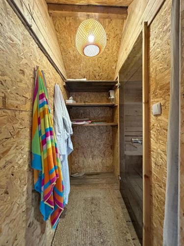 a bathroom with a shower and a towel on a wall at Privatzimmer auf Pferdehof in Vŭbel