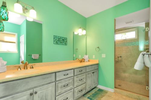 a bathroom with a double sink and a shower at Dolphin Daze by Pristine Properties Vacation Rentals in Saint Joe Beach