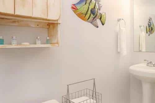 a bathroom with a sink and a towel rack at Deja Blue by Pristine Properties Vacation Rentals in Mexico Beach