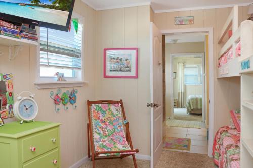 a childs room with a chair and a mirror at Summer Breeze by Pristine Properties Vacation Rentals in Indian Pass