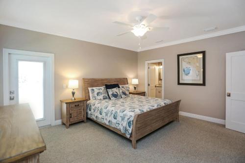a bedroom with a bed and a ceiling fan at Treasure Road by Pristine Properties Vacation Rentals in Indian Pass