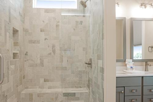 a bathroom with a shower and a sink at Las Brisas By Pristine Property Vacation Rentals in Saint Joe Beach