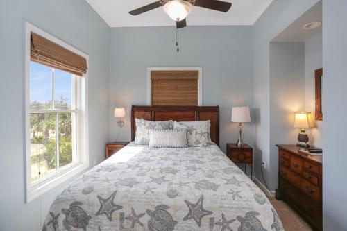 a bedroom with a large bed and a window at Coastal Cove by Pristine Properties Vacation Rentals in Indian Pass