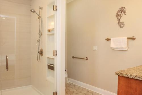 a bathroom with a shower and a toilet at Farr Away Living by Pristine Properties Vacation Rentals in Indian Pass
