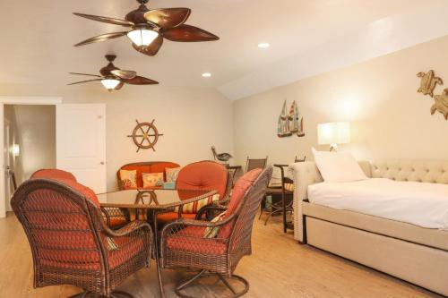a bedroom with a bed and a table and chairs at Farr Away Living by Pristine Properties Vacation Rentals in Indian Pass