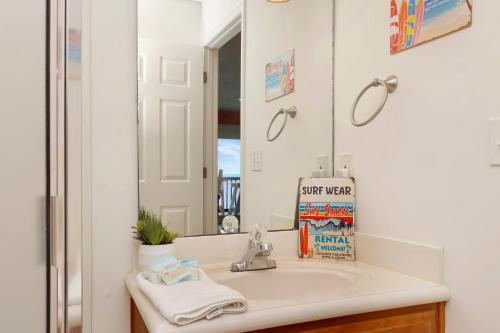 a bathroom with a sink and a mirror at Sun Chaser by Pristine Properties Vacation Rentals in Cape San Blas
