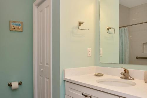 a bathroom with a sink and a mirror at Windsong by Pristine Properties Vacation Rentals in Mexico Beach
