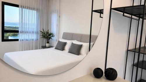 a bedroom with a bed in a swing at Sea 300 Villa in Migdal
