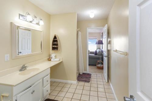a bathroom with a sink and a mirror at Pelican Landing 2 by Pristine Properties Vacation Rentals in Indian Pass