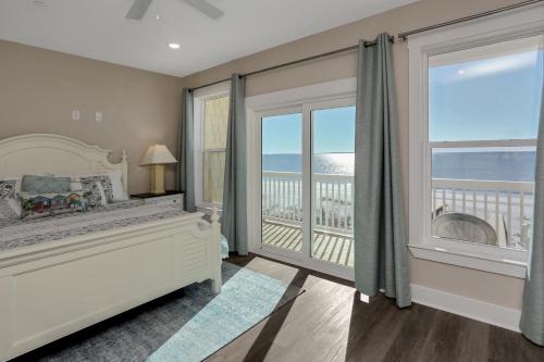 a bedroom with a bed and a view of the ocean at Pelican's Perch by Pristine Properties Vacation Rentals in Saint Joe Beach