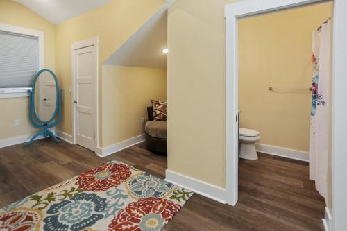 a living room with a toilet and a rug at Pelican's Perch by Pristine Properties Vacation Rentals in Saint Joe Beach