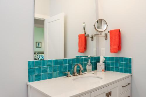 a bathroom with a sink and a mirror at Sea La Vie by Pristine Properties Vacation Rentals in Mexico Beach