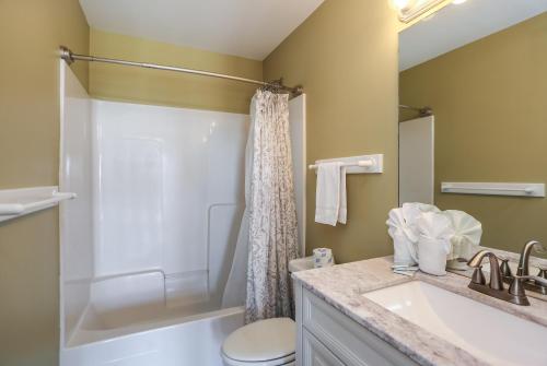 a bathroom with a sink and a toilet and a shower at A New Beginning by Pristine Properties Vacation Rentals in Indian Pass