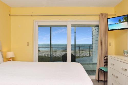 a bedroom with a bed and a view of the ocean at Indian Summer by Pristine Properties Vacation Rentals in Indian Pass