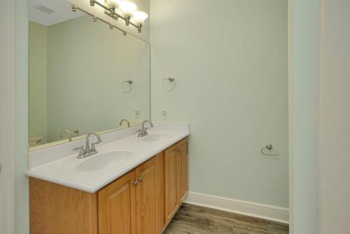 a bathroom with a sink and a mirror at Dunes Club 1A by Pristine Properties Vacation Rentals in Cape San Blas