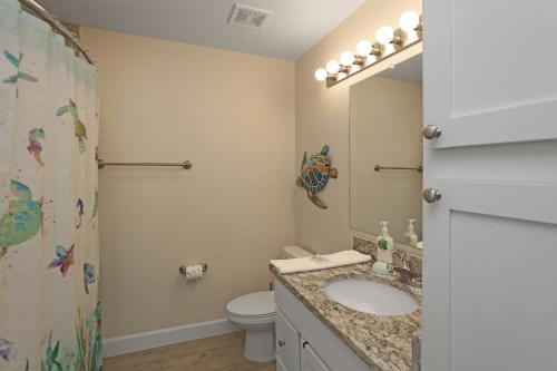 a bathroom with a sink and a toilet and a shower at Surfside 16 by Pristine Properties Vacation Rentals in Mexico Beach