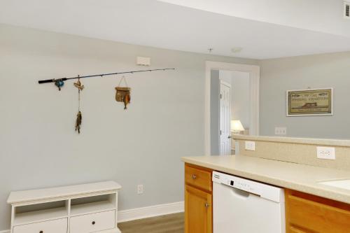 a kitchen with white walls and a white counter top at Dunes Club 1D by Pristine Properties Vacation Rentals in Cape San Blas