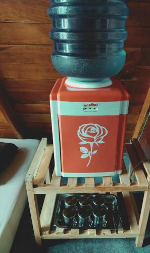 a vase sitting on top of a wooden stand at Banyu 2 in Palayangan