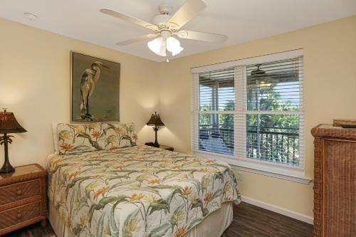 a bedroom with a bed and a ceiling fan at Sweet Destiny by Pristine Properties Vacation Rentals in Indian Pass