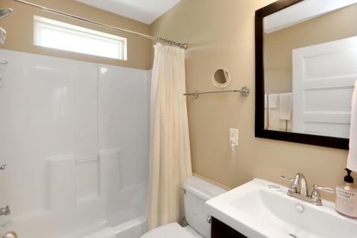 a bathroom with a sink and a toilet and a mirror at Sweet Destiny by Pristine Properties Vacation Rentals in Indian Pass