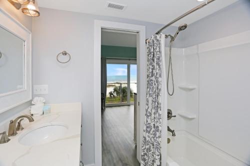 a bathroom with a shower and a sink at Sharla's Sunrise by Pristine Properties Vacation Rentals in Indian Pass
